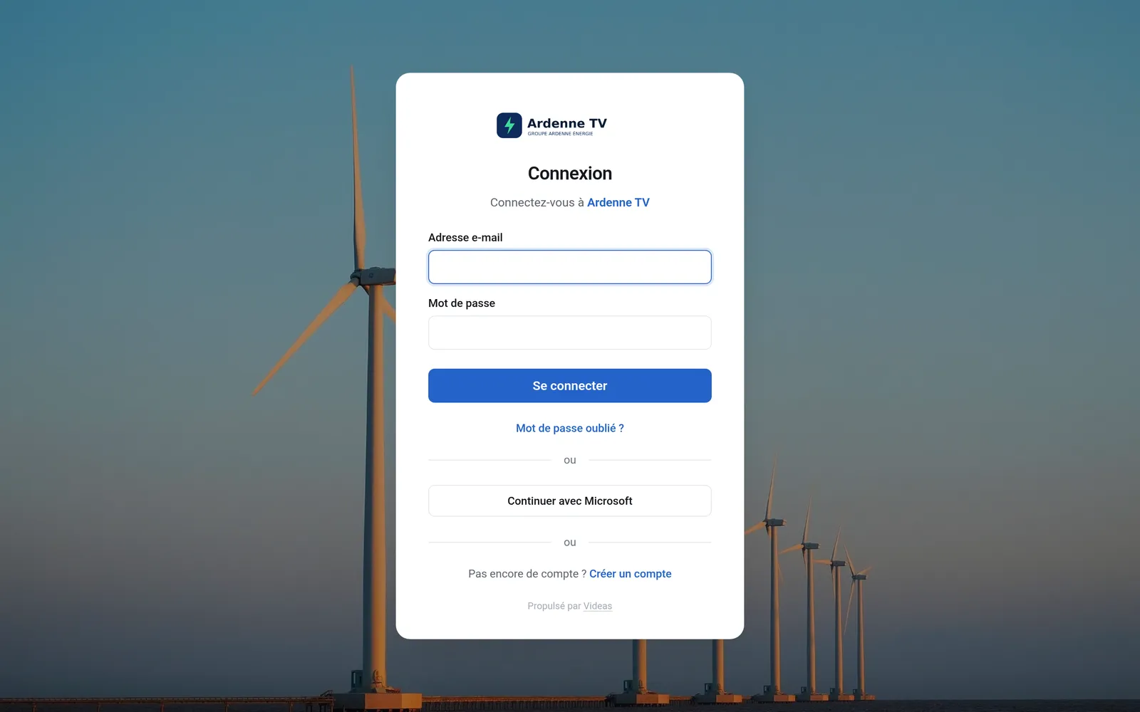 La page de connexion d'Ardenne TV, avec le logo du groupe, une photo de parc éolien en fond et le bouton Continuer avec Microsoft